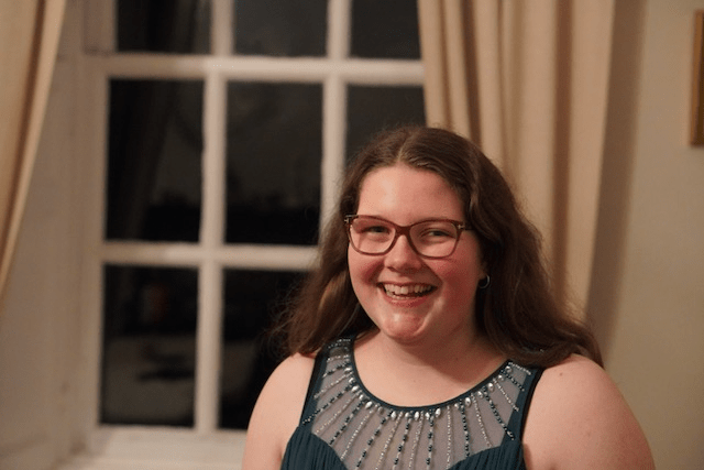 Photo of Anna in front of window